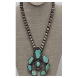 Fox Turquoise* & Sterling Squash Blossom Necklace