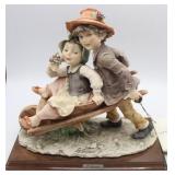 G. Armani Resin Boy & Girl Sculpture