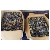 Two large boxes of bottle caps