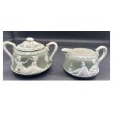 Wedgewood cream and sugar handle may have been