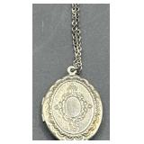 Engraved silver locket complete with chain