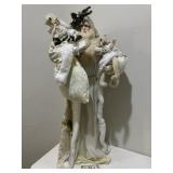 White Santa Holding Stuffed Animals