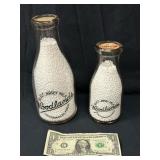 Two Woodlands Collectible Glass Millk Bottles
