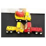 3 small tonka trucks.