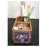 Craft supplies  in wooden basket.
