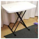 Portable collapsible table