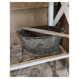 Cast iron kettle on stand with paddle