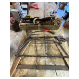 Assortment of saws in vintage saw box