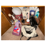 Contents of bathroom vanity, hand soap, curling iron, Conair clipper
