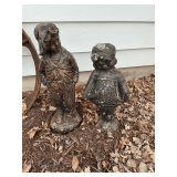 Yard art, boy and girl statue