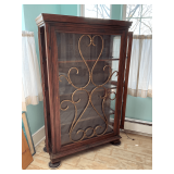 Lighted display cabinet, metal scrolling on front, glass shelves