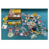 Political buttons and framed photos.