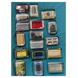Assortment of advertising glass paperweight