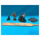 Vintage wood carving man carrying deer
