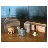Wisconsin cheese box, powder tin, small bell, carved elephant, etc.