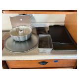 Bundt pan, Baker's Secret baking sheet, pizza pan, etc..