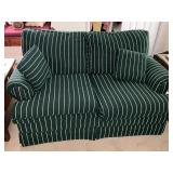 Upholstered love seat with throw pillows