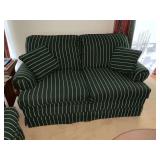 Upholstered love seat with throw pillows
