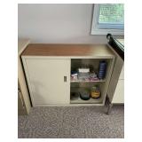 Sliding door cabinet with office supplies