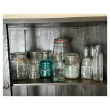 Glass insulator, bottles, blue jar with bail lid, etc.