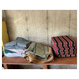 Packing blankets, tarp, patio chair cushions