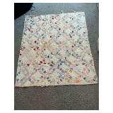 Hand quilted double wedding ring quilt, shows lots of wear