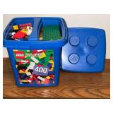 Blue Lego bucket with assorted Legos