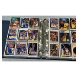 Trading card album with an assortment of basketball cards