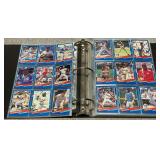 Trading card album with an assortment of baseball cards