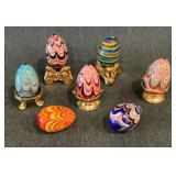 7 Hand blown glass eggs with 5 metal stands