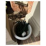 Plastic flower pot, hose, hide a key bird.