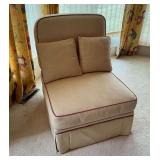Upholstered chair with throw pillows
