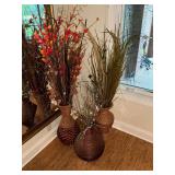 Trio of floral arrangements in woven baskets