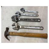 Assorted adjustable wrenches and claw hammer