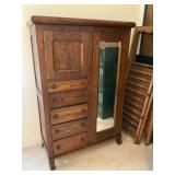 Antique wardrobe with mirror in door and key