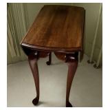 Queen Anne style drop leaf end table, top spins to hold up the leaves