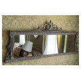 Ornately framed mirror, top left corner of frame is cracked