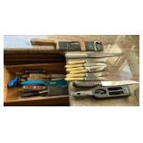 Collection of knives, sharpeners, cleaver