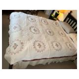 Embroidered hand quilted quilt, some wear and stains