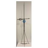 Lightning rod with globe and weather vane