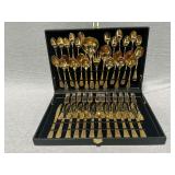 Golden flatware in lined box, service for 12