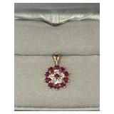 14KT yellow gold cluster pendant in a floral design of diamonds and rubies?
