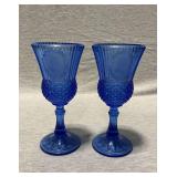 2 Avon Fostoria blue glass wine glasses, 8" T.