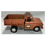 Tonka toy dump truck, spring loaded dump