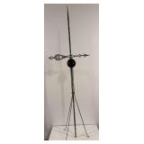 Lightning rod with globe and weather vane