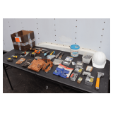 Arrow Staple Gun, Tool Belt and Attachments, Chalk Line, Tape Measures, Wall Anchors, Pit Bull Post Level, Hard Hat, Nails, and Misc.