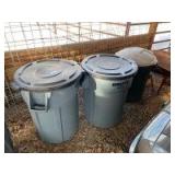 Three plastic trash canisters with lids