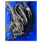 Box of various tack items, stirrups, headstalls, reins etc