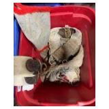 Tote of cinches and fly mask