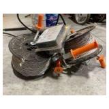 Two rolls of electric fence wire and replacement solar battery 6 V